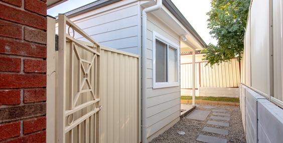 A clear and safe pedestrian pathway leads directly to the entrance of a contemporary secondary dwelling, satisfying the access requirements for Granny Flat Approvals NSW.